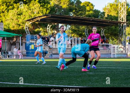 Female athletes training and playing soccer game in an outdoor stadium Stock Photo
