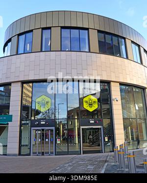 Pedestrian entrance to Stockport Interchange bus station with Bee Network branding on the glass frontage, Stockport, Greater Manchester, England, UK Stock Photo
