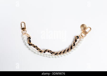 Top view of double decorative handbag chain with pearls and black braid Stock Photo