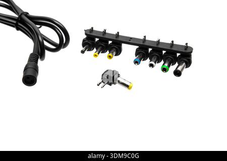 Close-up of universal power adapter DC connector tips with a power cable. Stock Photo