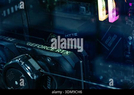 Close up of GeForce RTX graphics card inside desktop PC with RGB lighting and modern computer hardware details Stock Photo