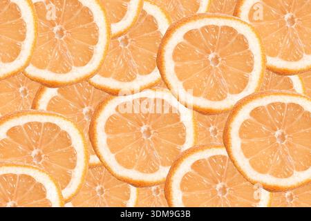 Fresh orange slices texture background closeup. Healthy citrus fruit pattern and natural vitamin food concept with juicy segments. Stock Photo