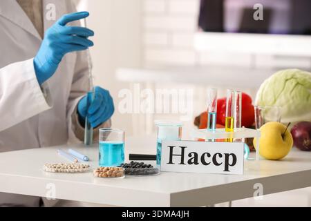 Scientist testing products in laboratory. HACCP concept Stock Photo