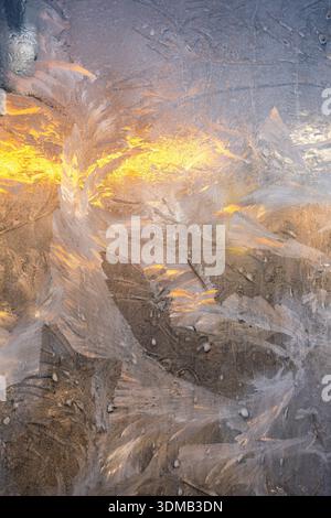 Frosty natural pattern and sunlight on winter window Stock Photo - Alamy