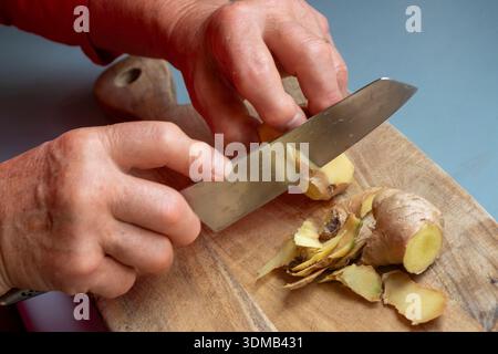 Cole-up of an elderly woman's arthritic hands performing kitchen chores Stock Photo