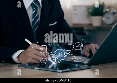 Businessman using computer chatting with an intelligent artificial intelligence asks for the answers wants. knowledge on the internet, e-learning, Rob Stock Photo