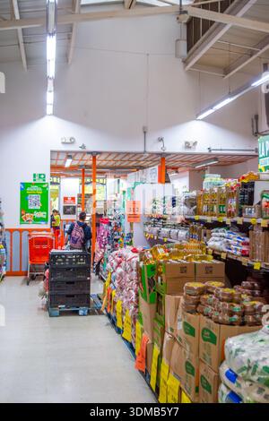Filandia, Quindio, Colombia - December 7 2025 - Grocery aisle with colorful merchandise and bright lighting. Stock Photo