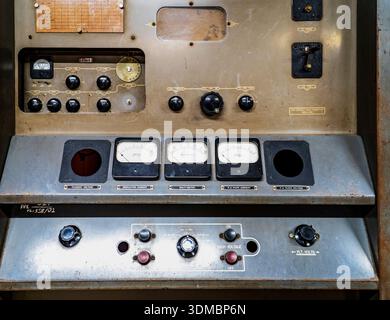 Aged metal control panel with switches and analogue gauges in craft ...