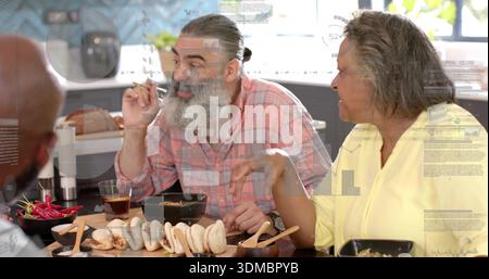Talking bearded man wearing pink plaid shirt leaning at dining table with steamed buns on board Stock Photo