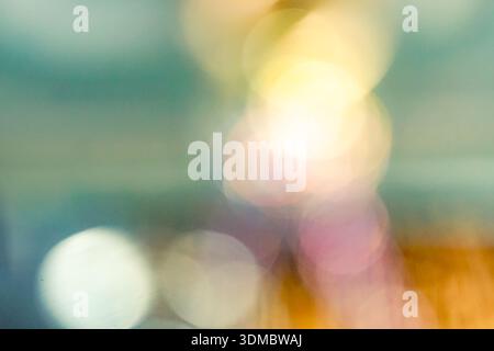 Dreamy abstract composition of vibrant blurred bokeh lights in multiple hues, suitable for design, wallpaper, and creative projects. Stock Photo