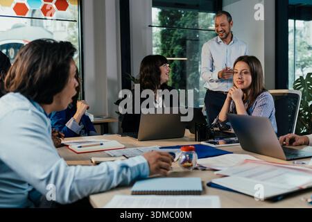 Business people having meeting, discussing project together Stock Photo