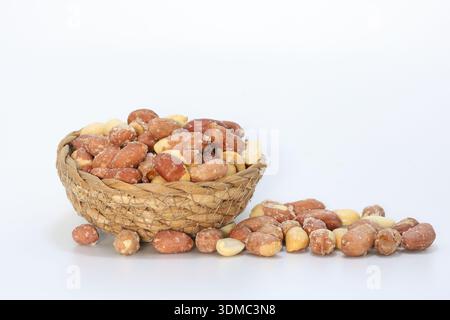roasted peanuts in a bowl on white background Stock Photo