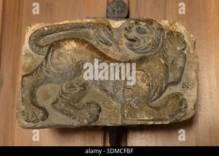 12th century bas-relief panel with a lion figure from Castelseprio, Castello Sforzesco, Milan, Italy. Stock Photo