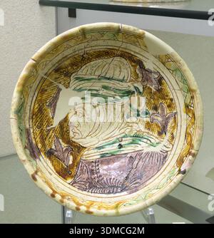 Pottery from the Veneto-Friuli area depicting male and female profiles dating from the late 14th to early 16th centuries, on display at the National M Stock Photo