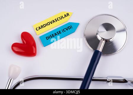 Cardiovascular disease - CVD text with stethoscope and heart shape Stock Photo
