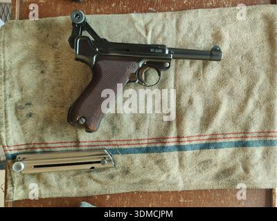 Detail of a classic historical German pistol used in the Second World War by the Nazis, the Luger P08 caliber 9mm at the shooting range Stock Photo