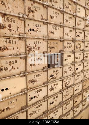 Vertical perspective photography of the multiple open safe deposit boxes in the old vault of the Central Bank of Barcelona Stock Photo