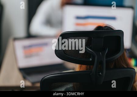 Business team member uses headset in a modern office for training and focus Stock Photo