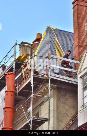 Slate re-roofing on a corner of an old building in a city center - Tours, Indre-et-Loire (37), France. Stock Photo