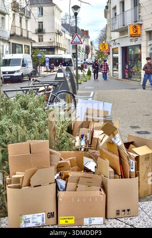 Stack of used cardboard boxes in city center awaiting collection by city council - Tours, Indre-et-Loire (37), France. Stock Photo