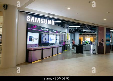 Samsung smartphone store and advertising display inside modern shopping mall in Cebu City Philippines showing consumer electronics retail. Stock Photo