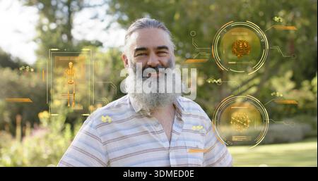 Smiling bearded man in striped shirt standing in sunny yard, with AR skeleton, brain, molecule HUDs Stock Photo