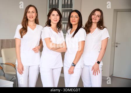 Doctors and nurses medical professionals at work together at clinic Stock Photo