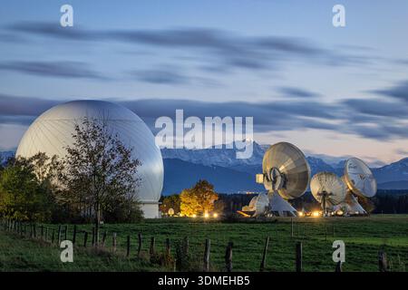 Raisting earth station and Zugspitze at dusk. Raisting, Bavaria, Germany. Stock Photo