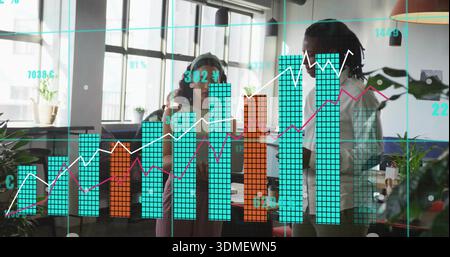 Analyzing team of three reviewing data overlay in office, wearing headphones, casual dress, laptop Stock Photo