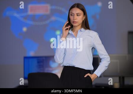 Confident Analyst in Security Operations Center Using Technology for Critical Monitoring Stock Photo