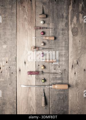 Christmas tree shape with old used vintage tools on an old rustic wooden workbench Stock Photo