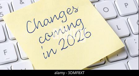Sticky note on a keyboard - Changes coming in 2026 Stock Photo