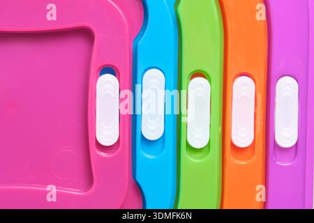 Abstract macro background of colorful plastic surfaces and geometric lines Stock Photo