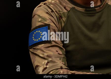 Patch of the European Union flag on military camouflage uniform. Stock Photo