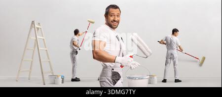 Professional house painters team working on an interior renovation project Stock Photo
