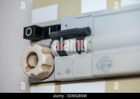 Macro photograph of an electric panel displaying numerical readings, switches, and circuits in sharp detail. Stock Photo