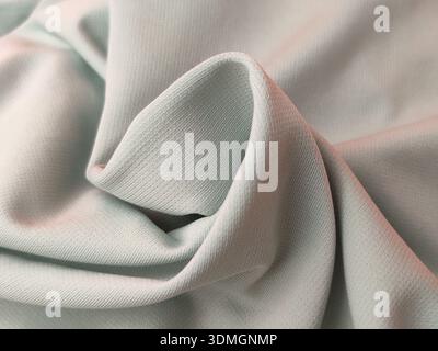 This appears to be a mint green ribbed knit fabric, likely made from a blend that includes polyester, cotton, or spandex. Stock Photo