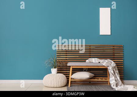 Interior of room with soft bench, pouf and folding screen Stock Photo
