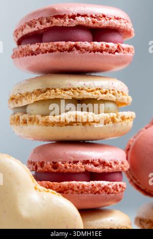 A stack of macarons shows different colors and flavors. Stock Photo
