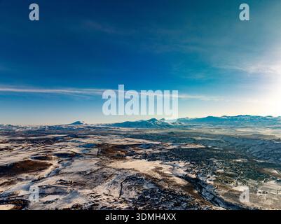 A clear blue sky with a few clouds. The sky is very bright and the clouds are small Stock Photo