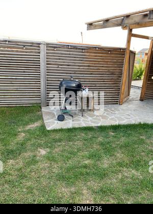 Portable grill in a summer patio Stock Photo