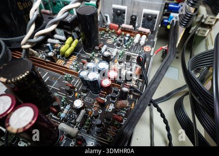 Internal view of complex electronic circuit board. Top down, close up, old power amplifier board Stock Photo