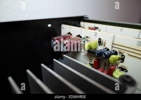 Internal view of complex electronic circuit board. Top down, close up, old power amplifier board Stock Photo