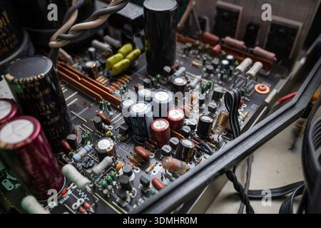 Internal view of complex electronic circuit board. Top down, close up, old power amplifier board Stock Photo