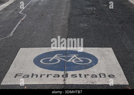 Image of a printed Blue and white bicycle frame symbol on a road Stock Photo