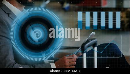 Interacting businessman in gray suit using tablet at airport lounge, rolling suitcase and HUD Stock Photo