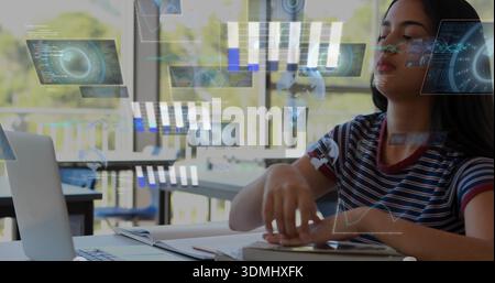 Studying student in striped tee reaching for notebook at library table, with laptop and AR overlay Stock Photo