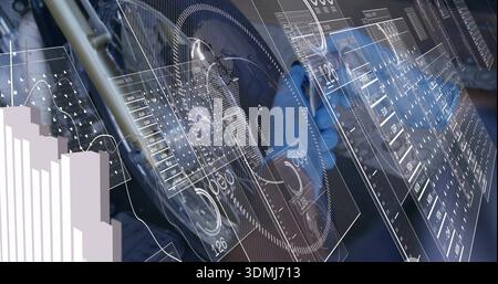 Showing centered wheel hub assembly overlaying translucent HUD panels in workshop lab with charts Stock Photo