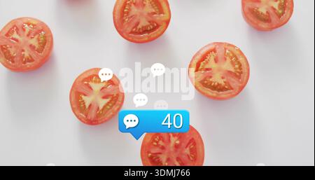 Displaying halved red tomatoes on white tabletop, blue chat badge showing 40 with speech icons Stock Photo