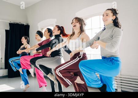 Young women dancing together during a studio rehearsal Stock Photo